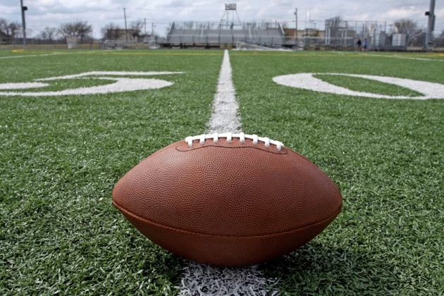 American Football on Outdoor Field at the 50 Yard Line
