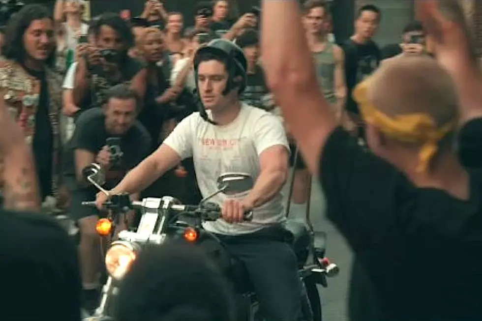 Concertgoer on Motorcycle Cruises Into Mosh Pit at Outdoor Punk Show